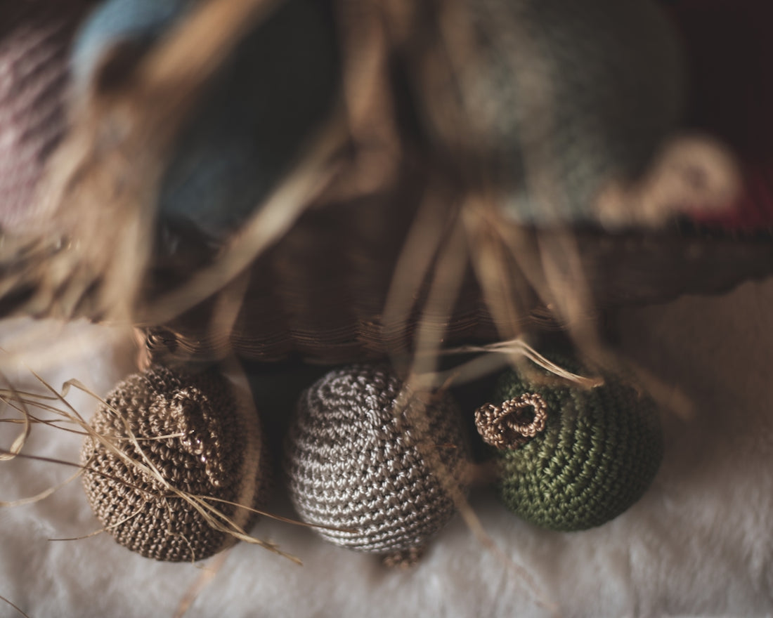 a group of knitted balls sitting on top of a table