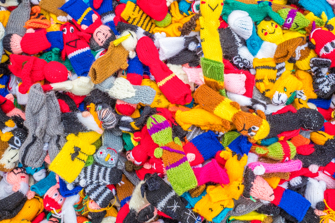 a pile of colorful stuffed animals