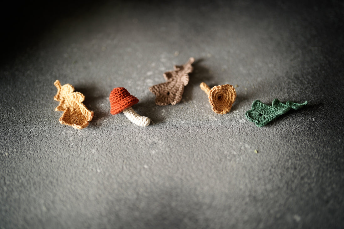 a group of crocheted animals sitting on top of a table