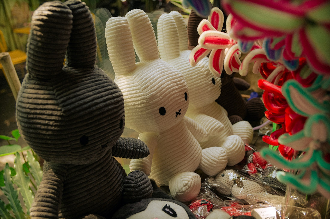 a couple of stuffed animals sitting next to each other